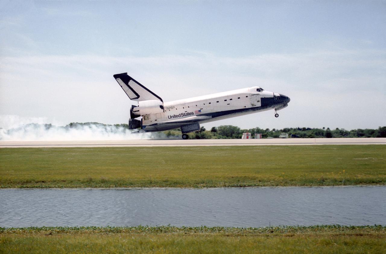 STS083-S-010 (8 April 1997) --- The main landing gear of the Space Shuttle Columbia touches down on the Shuttle Landing Facility (SLF) runway at the Kennedy Space Center (KSC), after completing almost four days of a scheduled 16-day mission in Earth-orbit.  A problem with one of three fuel cells led to an early landing for the seven-member Microgravity Science Laboratory 1 (MSL-1) crew.  Touchdown occurred at 1:33:11 p.m. (EDT), April 8, 1997.  Onboard Columbia were James D. Halsell, Jr., Susan L. Still, Janice E. Voss, Donald A. Thomas, Michael L. Gernhardt, Roger K. Crouch and Gregory T. Linteris.