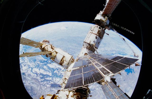 NASA image: View of Mir Space Station as seen from flight deck overhead window and Spacehab