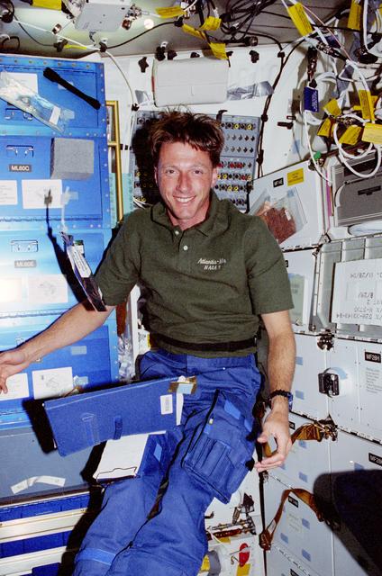 NASA image: Crewmember activity in the shuttle middeck and flight deck