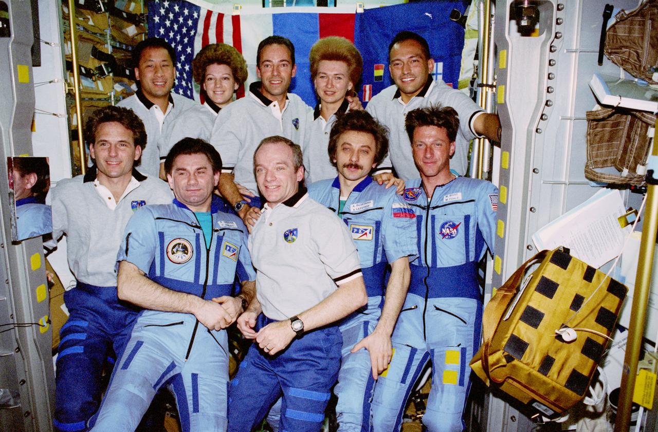 STS084-366-015 (15-24 May 1997) --- Crewmembers from Mir-23 and STS-84 assemble for a group portrait onboard the Spacehab Double Module, as they tie a record (ten) for number of persons aboard a single orbiting spacecraft at one time.  They are (from the left, front) Jerry M. Linenger, Vasili V. Tsibliyev, Charles J. Precourt, Aleksandr I. Lazutkin and C. Michael Foale. On the back row, from the left, are Edward T. Lu, Eileen M. Collins, Jean-Francois Clervoy, Elena V. Kondakova and Carlos I. Noriega.