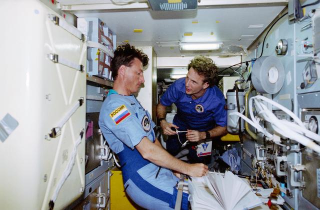 NASA image: Linenger and Foale conduct transfer ops in the Priroda module