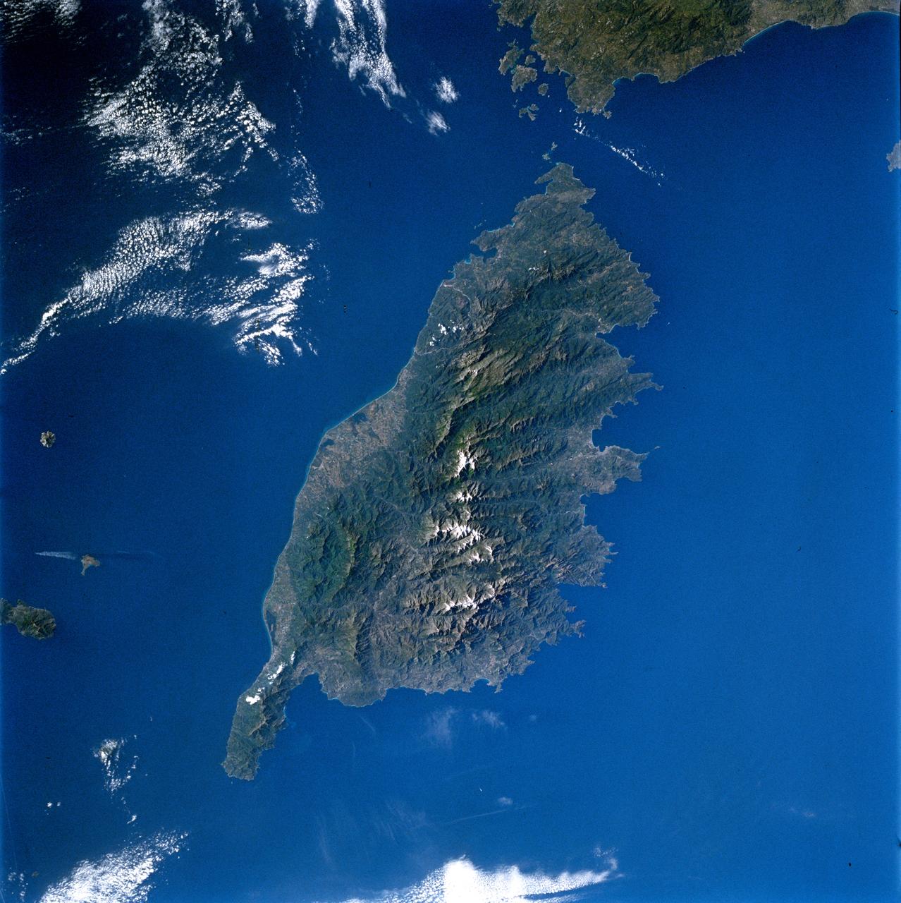 STS084-714-007 (15-24 May 1997) --- This 70mm image of the island of Corsica was photographed from the Space Shuttle Atlantis during the STS-84 mission. Birthplace of Napoleon Bonaparte, Corsica is the fourth largest island (after Sicily, Sardinia, and Cyprus) in the Mediterranean. Two-thirds of the island is mountainous with the majority of the population (1990-249, 737) living on the east coast (the "handle on the island points north). French is the official language.