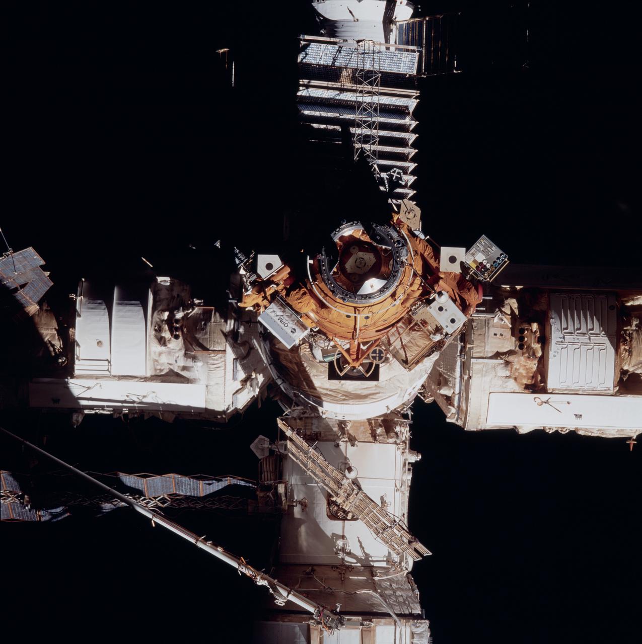 STS084-730-002 (15-24 May 1997) --- A Space Shuttle Atlantis point-of-view frame showing the docking port and target during separation from with Russia's Mir Space Station. The picture should be held with the retracted Kristall solar array at right. Other elements partially visible are Kvant-2 (top), Spektr (bottom) and Core Module (left).