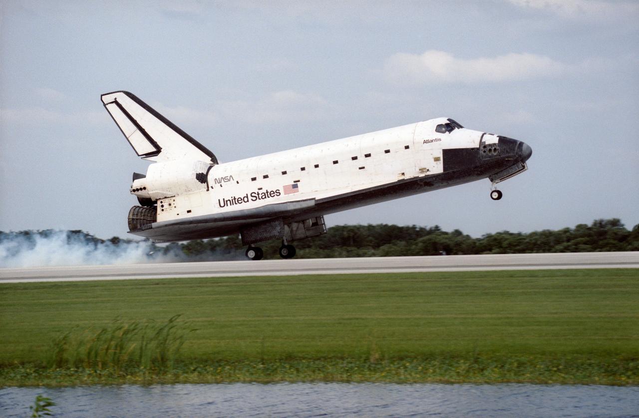 STS084-S-012 (24 May 1997) --- The Space Shuttle Atlantis touches down on Runway 33 of the Kennedy Space Center (KSC) Shuttle Landing Facility (SLF), bringing to a completion the nine-day mission. Main gear touchdown was at 9:27:44 a.m. (EDT), May 24, 1997. This touchdown marked the 37th landing at KSC in the 16-year history of the Space Transportation System (STS) and it also marked the return of astronaut Jerry M. Linenger to Earth following almost four months aboard Russia's Mir Space Station. Onboard for the landing were astronauts Charles J. Precourt, Eileen M. Collins, Jean-Fran?ois Clervoy, Carlos I. Noriega, Edward T. Lu, Linenger and Elena V. Kondakova. Clervoy is with the European Space Agency (ESA) and Kondakova represents the Russian Space Agency (RSA).