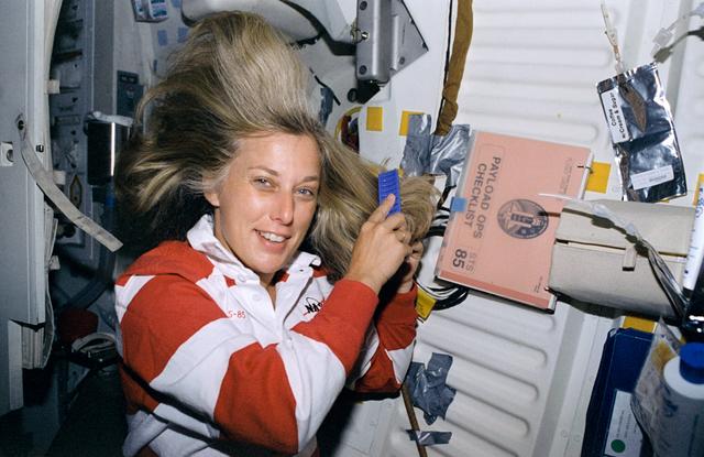 NASA image: Davis combs her hair