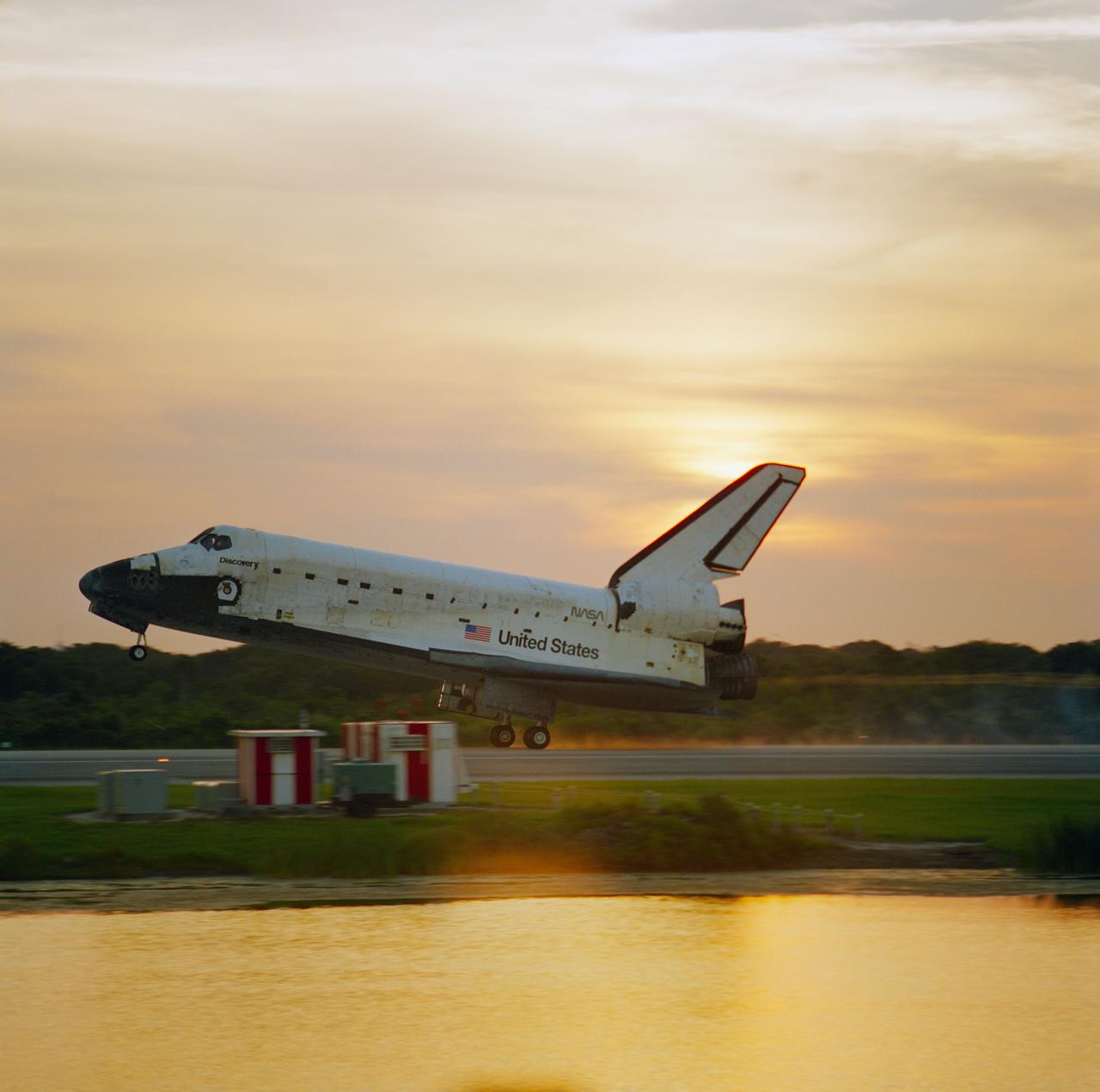 STS085-S-014 (19 Aug. 1997) --- The main landing gear of the space shuttle Discovery touches down on Runway 33 at the Kennedy Space Center to mark the successful completion of 12-day STS-85 mission. Landing occurred at 7:08 a.m. (EDT) on Aug. 19, 1997. Onboard were astronauts Curtis L. Brown, mission commander; Kent V. Rominger, pilot; N. Jan Davis, payload commander; and Robert L. Curbeam and Stephen K. Robinson, both mission specialists; along with payload specialist Bjarni Tryggvason, representing the Canadian Space Agency. Photo credit: NASA