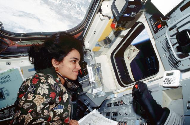 NASA image: Kalpana Chawla directs the EVA from inside the flight deck
