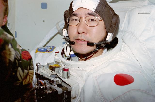NASA image: Doi and Scott prep for EVA wearing EMUs in airlock