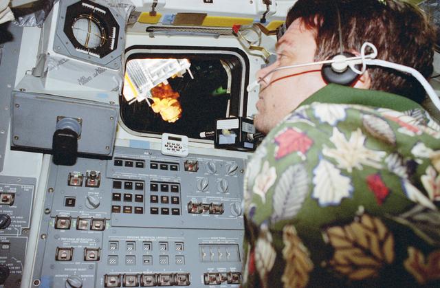 NASA image: Kregel and Lindsey fly the shuttle closer to the Spartan satellite