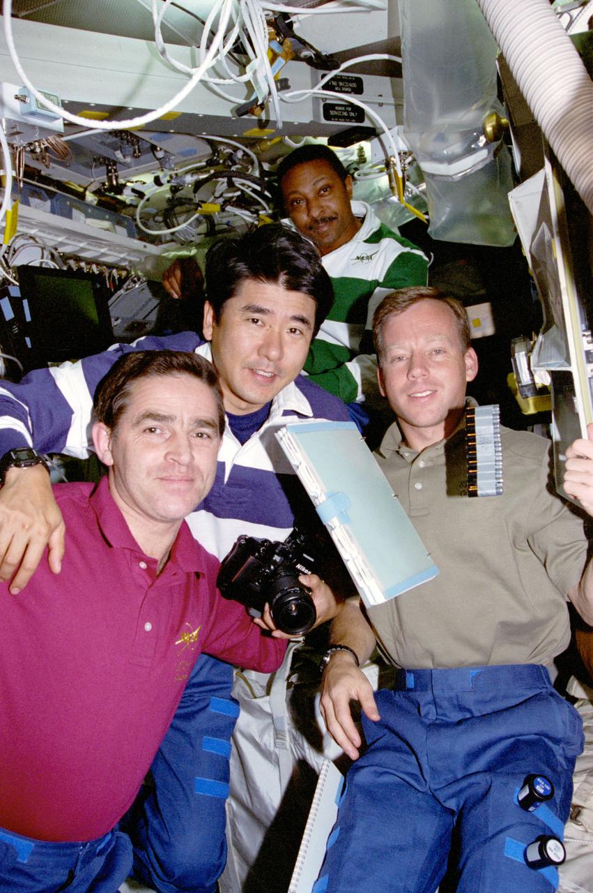 STS087-353-034 (19 November - 5 December 1997) --- Two-thirds of the crew members are pictured on the mid-deck of the Earth-orbiting Space Shuttle Columbia. From the left are Leonid Kadenyuk, payload specialist of the Ukraine; Takao Doi, international mission specialist representing Japan's National Space Development Agency (NASDA); Winston E. Scott, mission specialist; and Steven W. Lindsey, pilot. Doi was joined on two Extravehicular Activities (EVA) during the 16-day United States Microgravity Payload (USMP-4) mission by Scott.