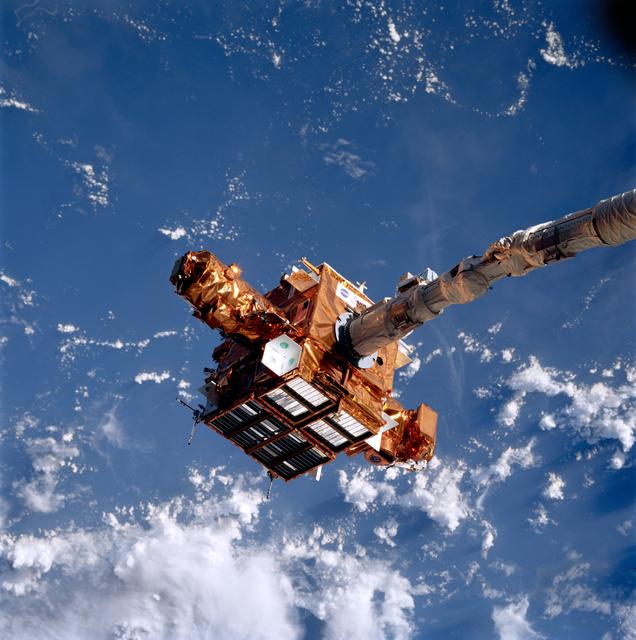 NASA image: SPARTAN satellite on RMS arm prior to release
