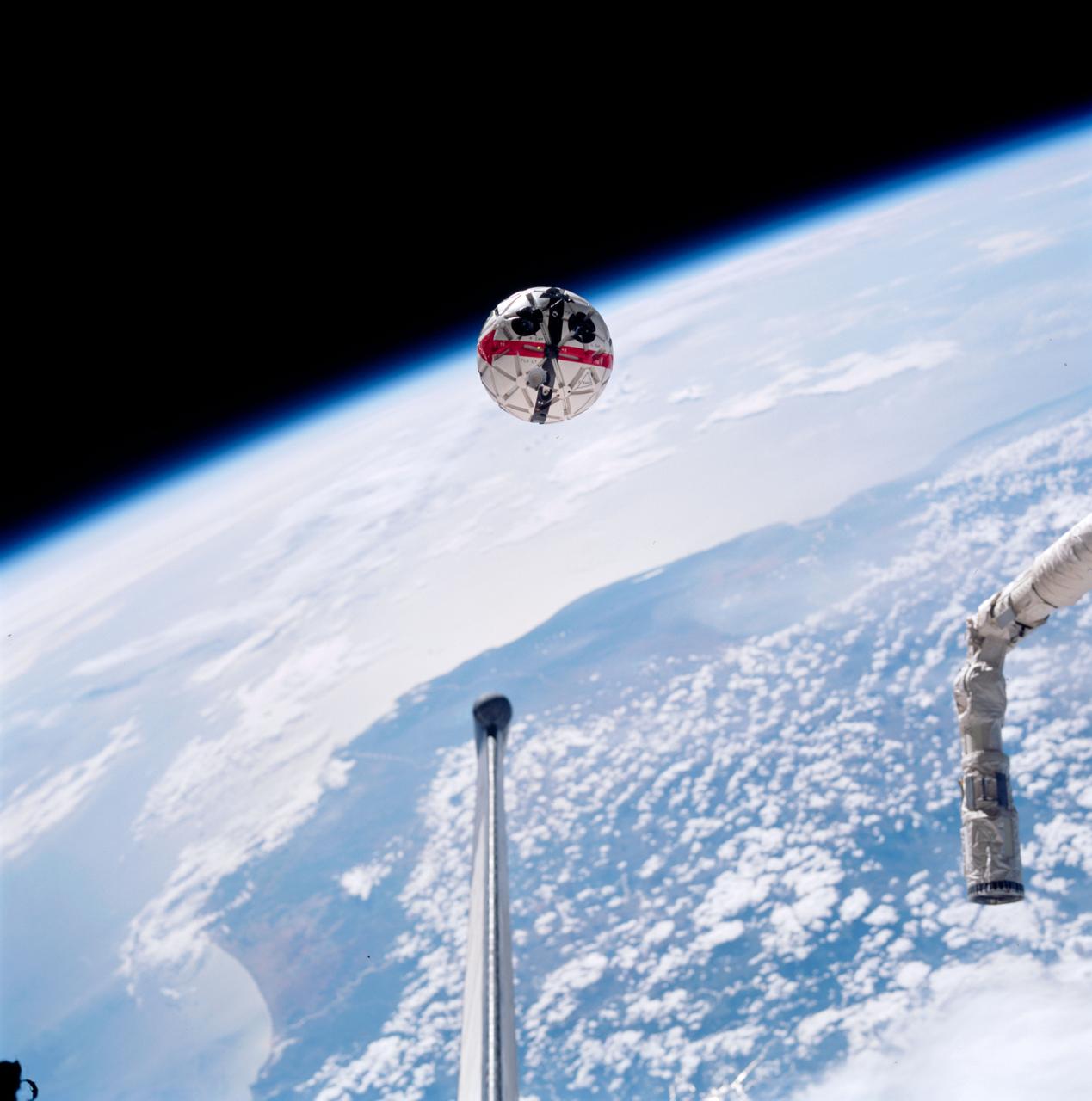 STS087-752-034 (19 November - 5 December 1997) --- This out-the-window view shows the Autonomous Extravehicular Activity Robotic Camera Sprint (AERCam Sprint) free-flying in the vicinity of the cargo bay of the Earth-orbiting Space Shuttle Columbia. The AERCam Sprint is a prototype free-flying television camera that could be used for remote inspections of the exterior of the International Space Station (ISS). This view, backdropped over southern Madagascar, was taken during this flight's second extravehicular activity (EVA), on December 3, 1997.