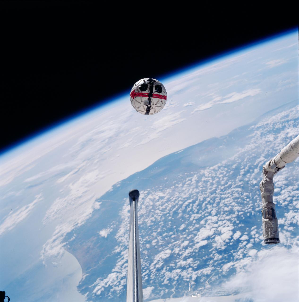 STS087-752-035 (19 November – 5 December 1997) --- This out-the-window view shows the Autonomous Extravehicular Activity Robotic Camera Sprint (AERCam Sprint) free-flying in the vicinity of the cargo bay of the Earth-orbiting Space Shuttle Columbia. The AERCam Sprint is a prototype free-flying television camera that could be used for remote inspections of the exterior of the International Space Station (ISS). This view, backdropped over southern Madagascar, was taken during this flight's second Extravehicular Activity (EVA), on December 3, 1997.
