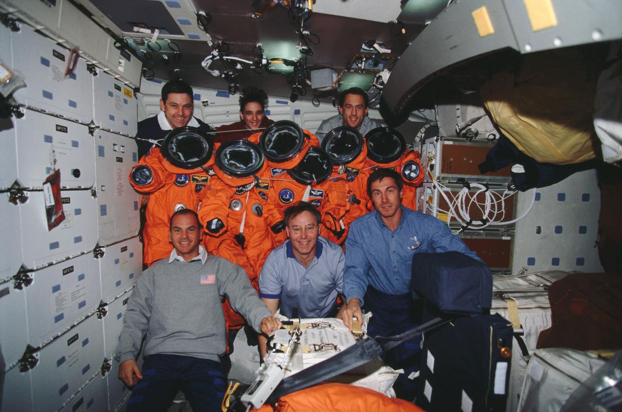 STS088-313-022 (4-15 December 1998) --- The six crew members pose with their launch and entry suits (LES) on the middeck of the Earth-orbiting Space Shuttle Endeavour.  From the left (front) are Frederick W. "Rick" Sturckow, pilot; Jerry L. Ross and Sergei K. Krikalev, both mission specialists; (rear), Robert D. Cabana, mission commander; Nancy J. Currie and James H. Newman, both mission specialists.  Cosmonaut Krikalev, recently named as a crew member for the first mission to the International Space Station (ISS), is representing the Russian Space Agency (RSA).