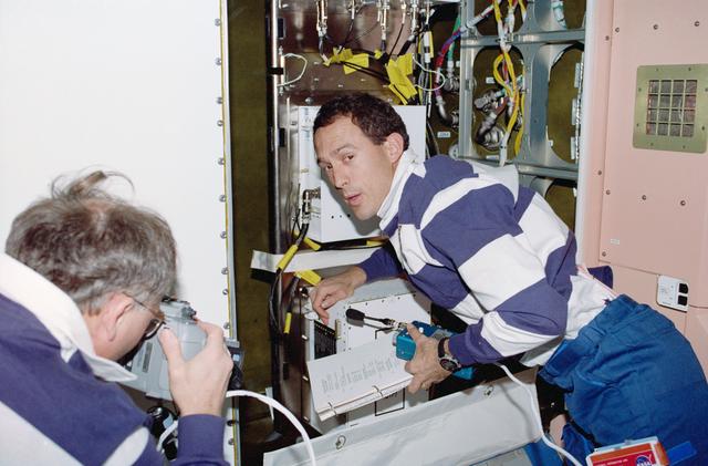 NASA image: Newman and Ross work on the Early Communications System in Node 1