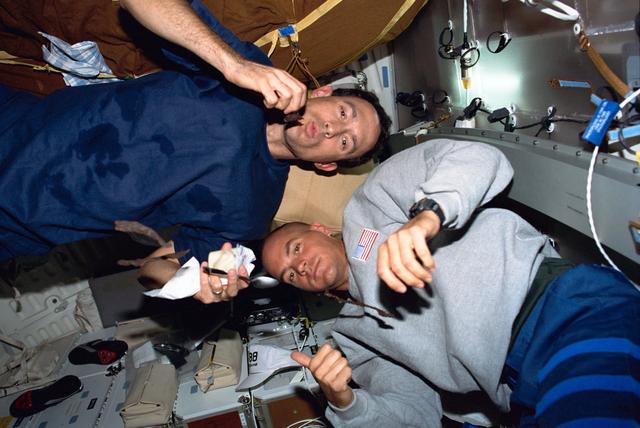 NASA image: Newman and Sturckow on the middeck with beef jerky