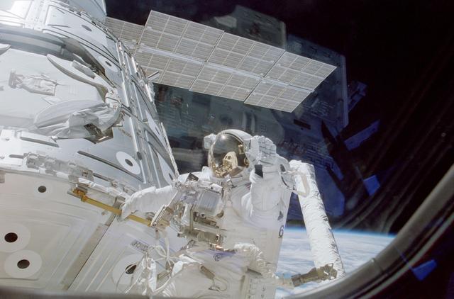 NASA image: Astronaut Newman holds handrail 0133 on panel NOD1/C2-07