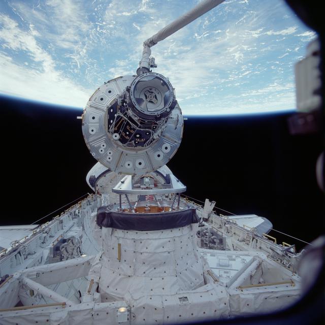 NASA image: Forward (+XA) end of Node 1 and PMA2 as the module is grappled by the RMS arm