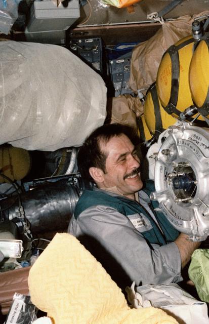 NASA image: Vinogradov organizes stowage bags on Mir