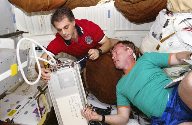 NASA image: MS Wolf and MS Thomas work on the Cocult experiment together