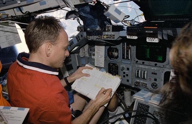NASA image: Pilot Edwards reads a rendezvous timeline