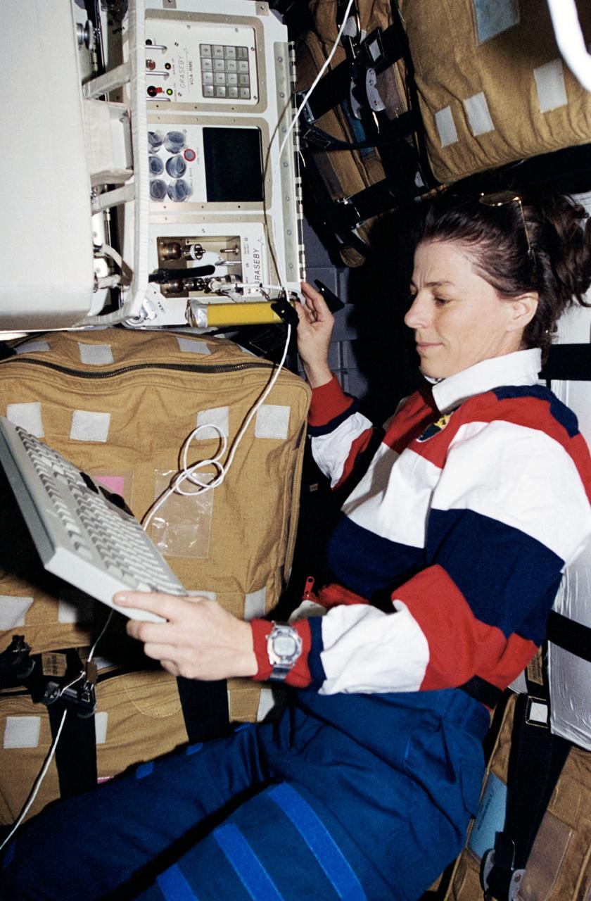 STS089-390-036 (22-31 Jan 1998) --- Astronaut Bonnie J. Dunbar, payload commander, checks out the Volatile Organic Analyzer (VOA) in the Spacehab Double Module aboard the Earth-orbiting Space Shuttle Endeavour.  VOA was among a number of experiments monitored by the crew on Spacehab, while other payloads and experiments were stowed and conducted in Endeavour?s cabin.