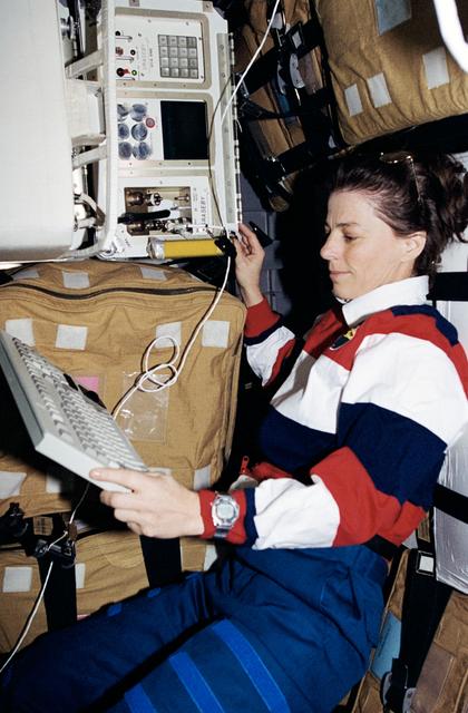 NASA image: VOA - MS Dunbar works with the Volatile Organics Analyzer (VOA)