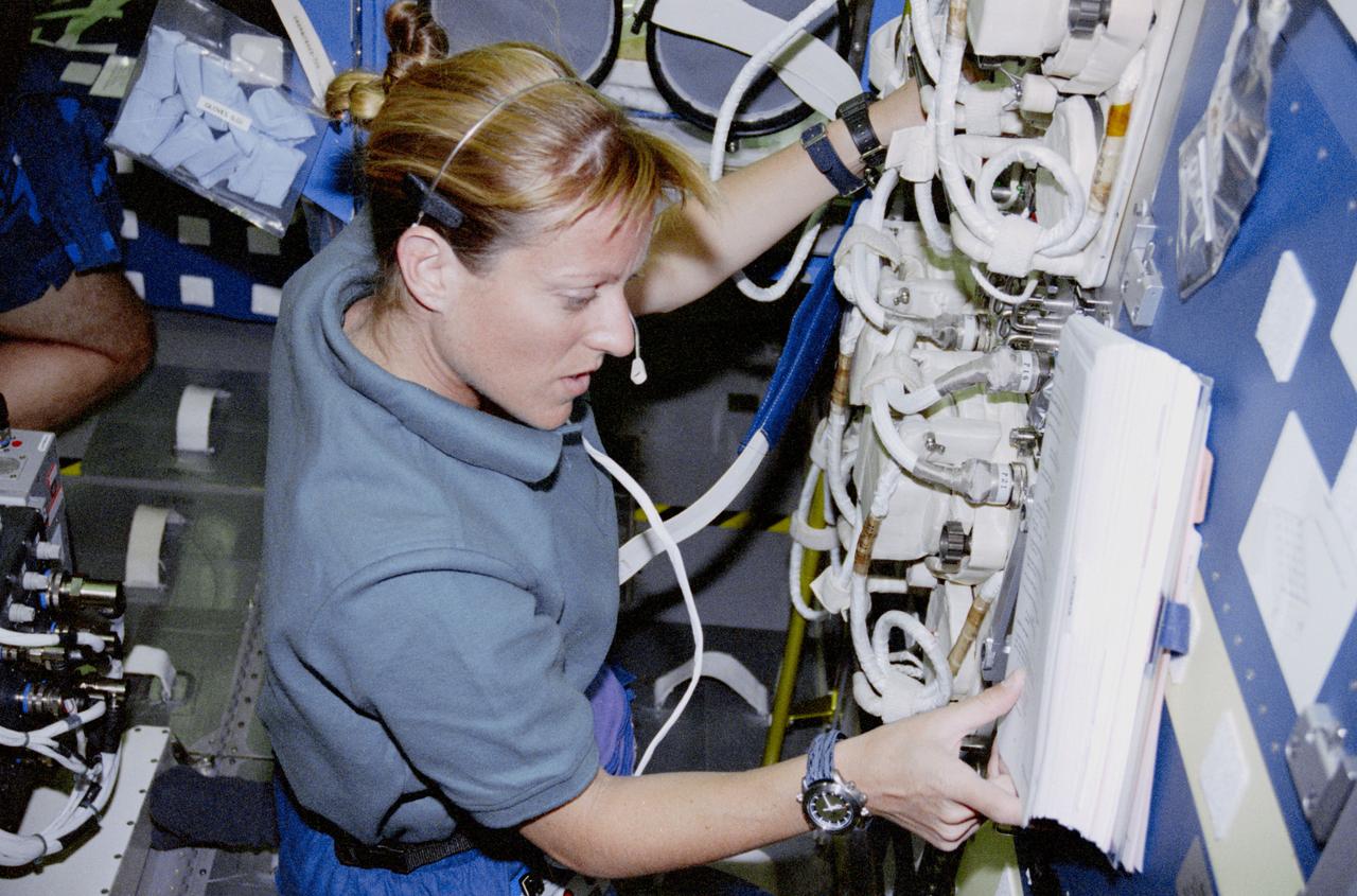STS090-350-001 (17 April - 3 May 1998) --- Astronaut Kathryn P. Hire, mission specialist, checks out part of the Neurolab's Vestibular Function Experiment Unit (VFEU).  She joined four other astronauts and two payload specialists for 16-days of research in support of the Neurolab mission.