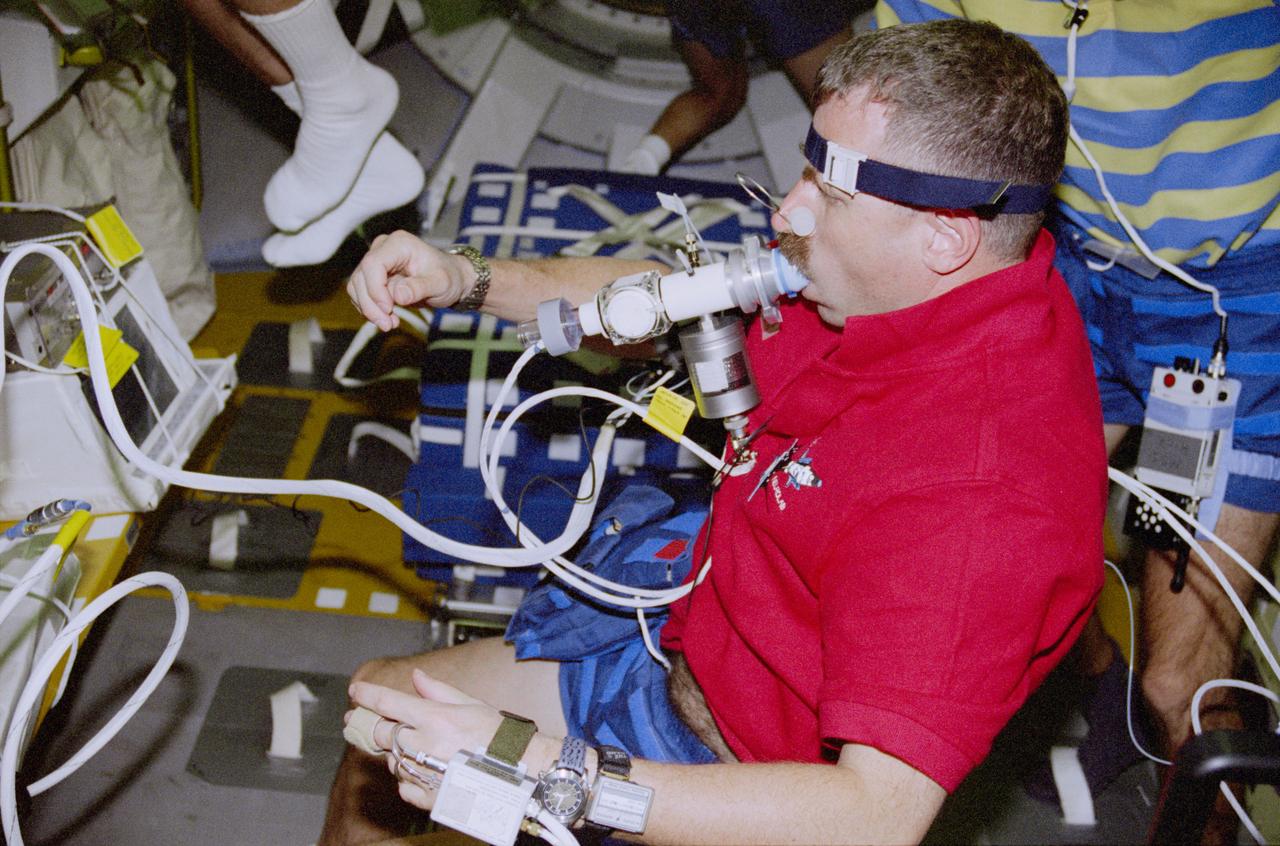 STS090-350-002 (17 April - 3 May 1998) --- Astronaut Dafydd R. (Dave) Williams, mission specialist representing the Canadian Space Agency (CSA), is pictured during a Neurolab pulmonary function test.  Williams joined four NASA astronauts and two payload specialists for 16-days aboard the Space Shuttle Columbia in support of the Neurolab mission.