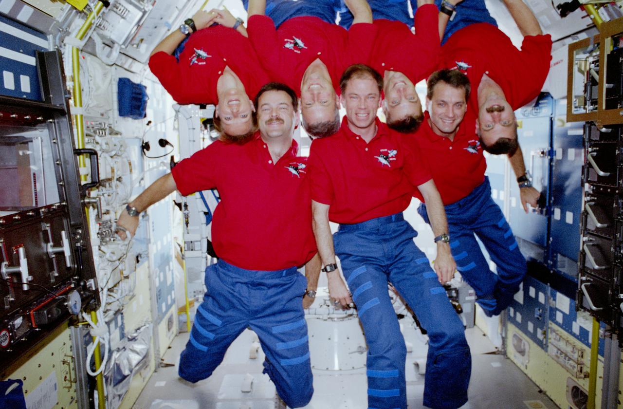 STS090-378-019 (17 April - 3 May 1998) --- The Neurolab crew takes advantage of the weightlessness in the Spacelab Science Module to add a unique twist to one of their traditional in-flight space portraits.  From the left (with feet toward the floor) are Scott D. Altman, pilot; Richard A. Searfoss, mission commander; and Richard M. Linnehan, payload commander.  Others, from the left, are Kathryn P. Hire, mission specialist; Jay C. Buckey, Jr. and James A. (Jim) Pawelczyk, both payload specialists; and Dafydd R. (Dave) Williams, mission specialist representing the Canadian Space Agency (CSA).