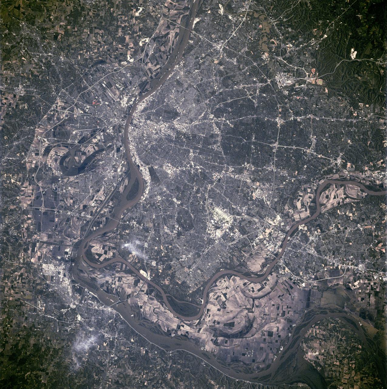 STS090-755-062 (17 April - 3 May 1998) --- The Mississippi River stands out among the geographic features in this view of the St. Louis, Missouri and East St. Louis, Illinois area as photographed with a 70mm handheld camera from the Space Shuttle Columbia.  The Shuttle was flying at almost a nadir position to the area when the photo was taken.  The picture should be held with the two major rivers at the top of the frame in order for north to be toward the top.  The Illinois-Missouri Border is easily delineated by following the Mississippi River from upper left to bottom center.  The Missouri River separates St. Charles and St. Louis counties several miles inside the Mississippi at top center.