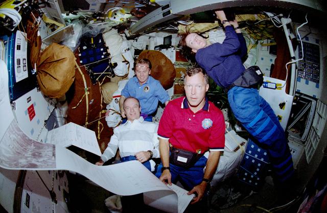 NASA image: Crewmember activity in the middeck during delivery of morning mail messages