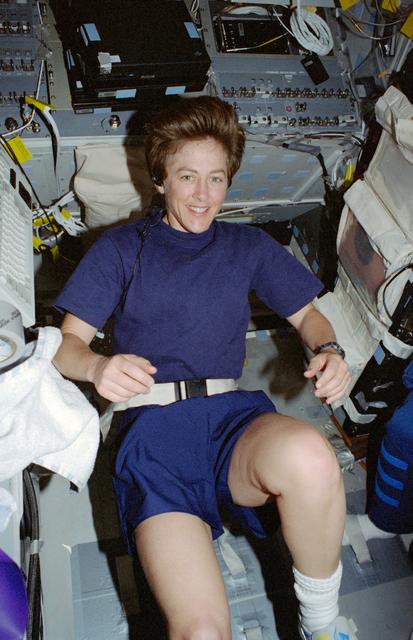 NASA image: Lawrence exercises on the flight deck ergometer