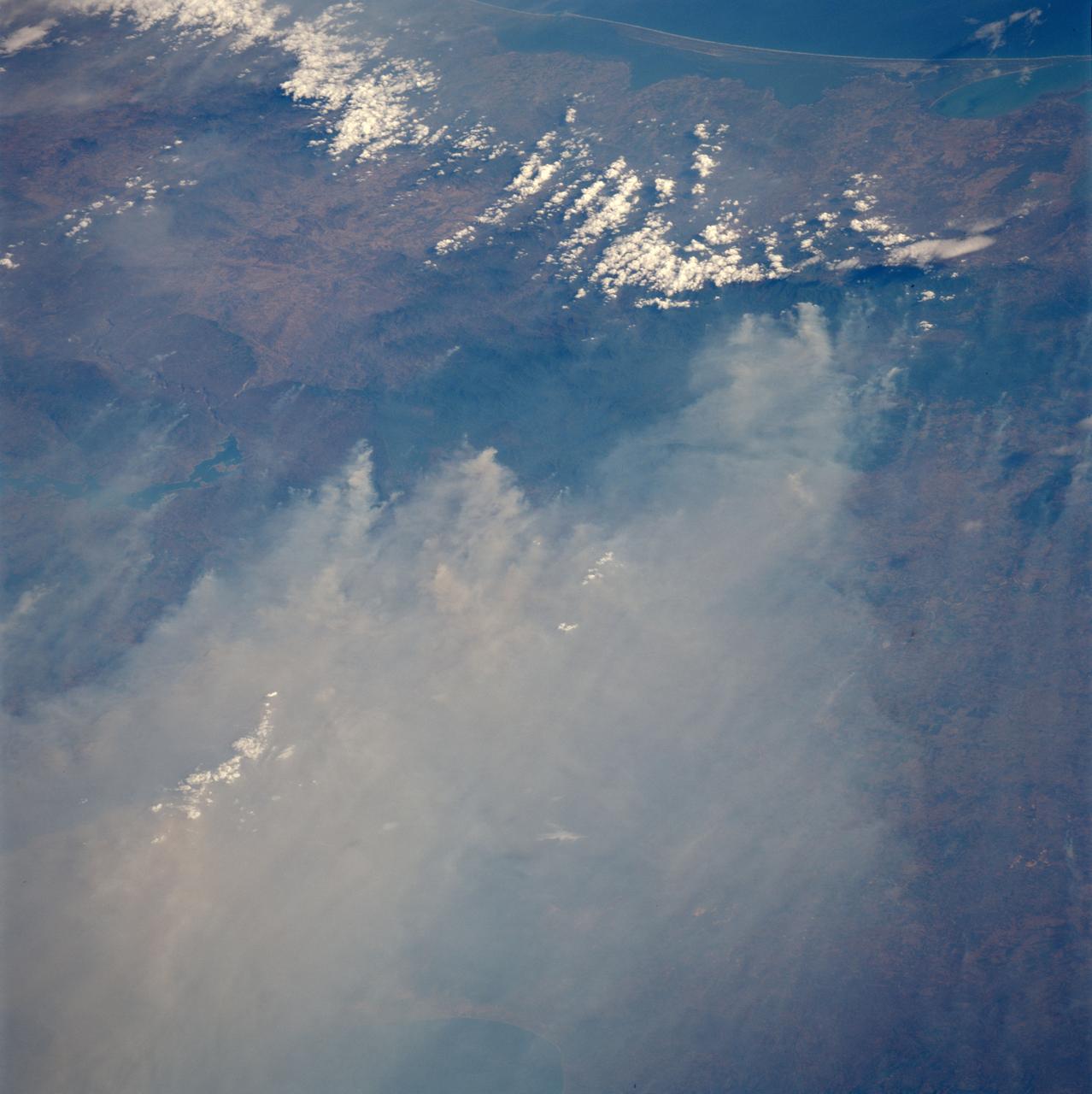 STS091-701-075 (2-12 June 1998) --- Fires across Mexico and Central America which created heavy smoke plumes for a few weeks in May and June, 1998, were recorded on 70mm film by the crewmembers   of STS-91.  The smoke circulated around a high pressure system over the Gulf of Mexico and brought thick smoke and soot to the south central United States.   Scientists are looking at burning regions like this around the world to study the smokes affect on the albedo or the reflectance of the sun's rays and how it may influence the world's climate. This view captures the area from the Gulf of Tehuantepec, on the south side, to the Bay of Campeche to the north in early June 1998.