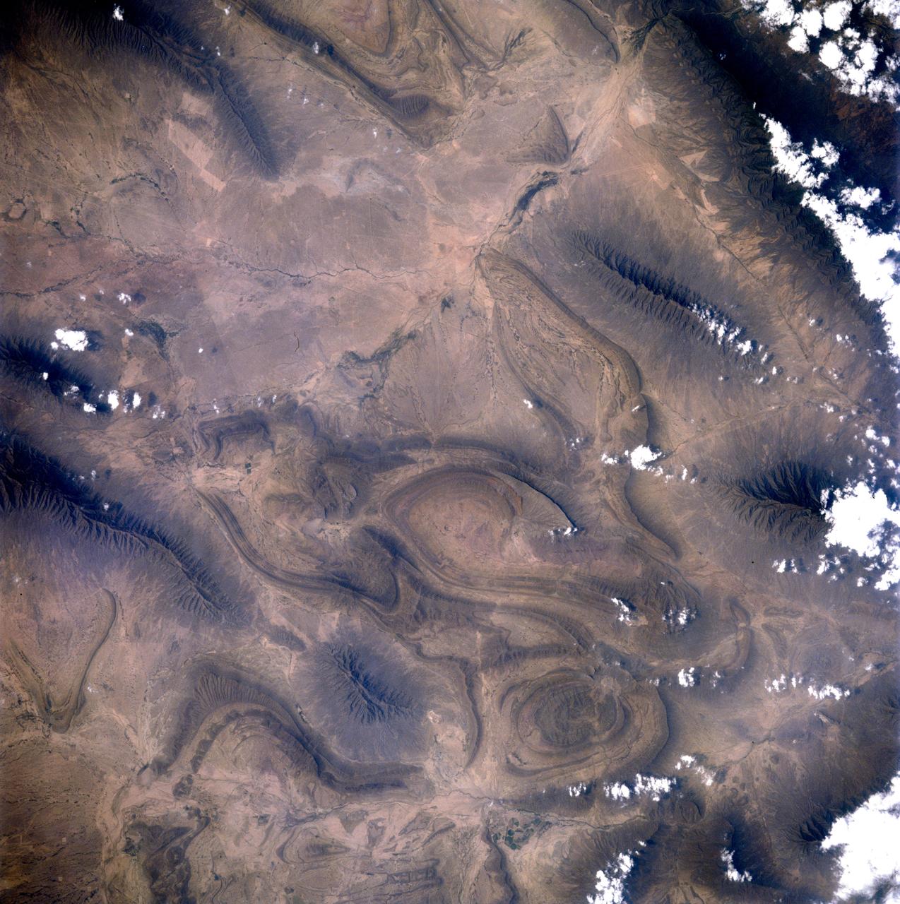 STS091-707-008 (2-12 June 1998) --- Photographed by one of the STS-91 crew members aboard the Space Shuttle Discovery, this area northwest of Monterrey, Mexico is a good example of a tectonic landform where the Earth's crust folds in a "wrinkled-rug" style. The Sierra Madrid Oriental is the easternmost extension of the North American Cordillera. The complicated structure of this arid region is the affects of wind eroding the softer rocks and leaving the harder ones making it look like it may be a photo of another planet. Monclova, Mexico is located near the center of the photo.