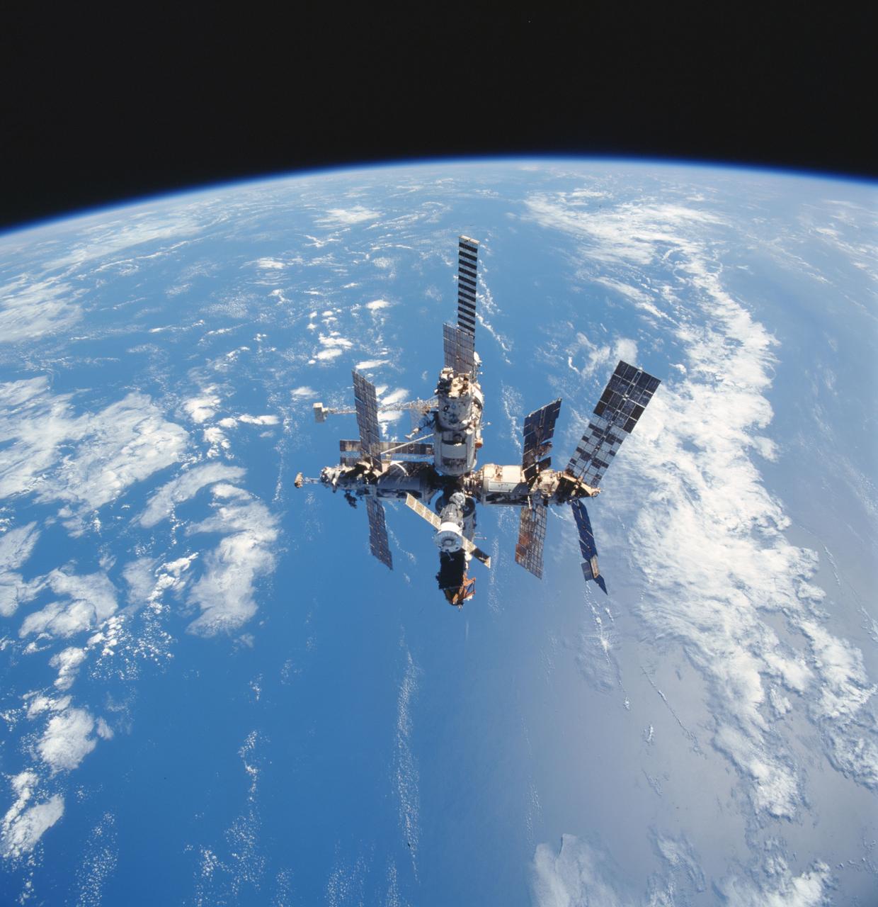 STS091-707-090 (2-12 June 1998) --- Russia's Mir space station is captured on film as it floats above the blue and white planet Earth during Shuttle-Mir final fly-around.