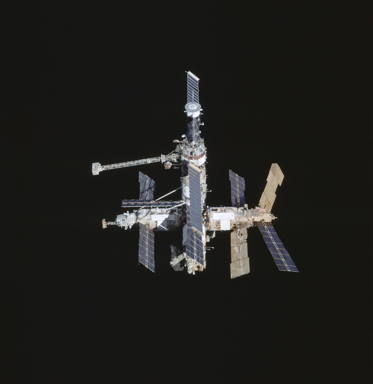 STS091-711-020 (2-12 June 1998) --- Backdropped against the darkness of space, Russia's Mir space station is captured on film as it moves away from the Space Shuttle Discovery during Shuttle-Mir final fly-around.