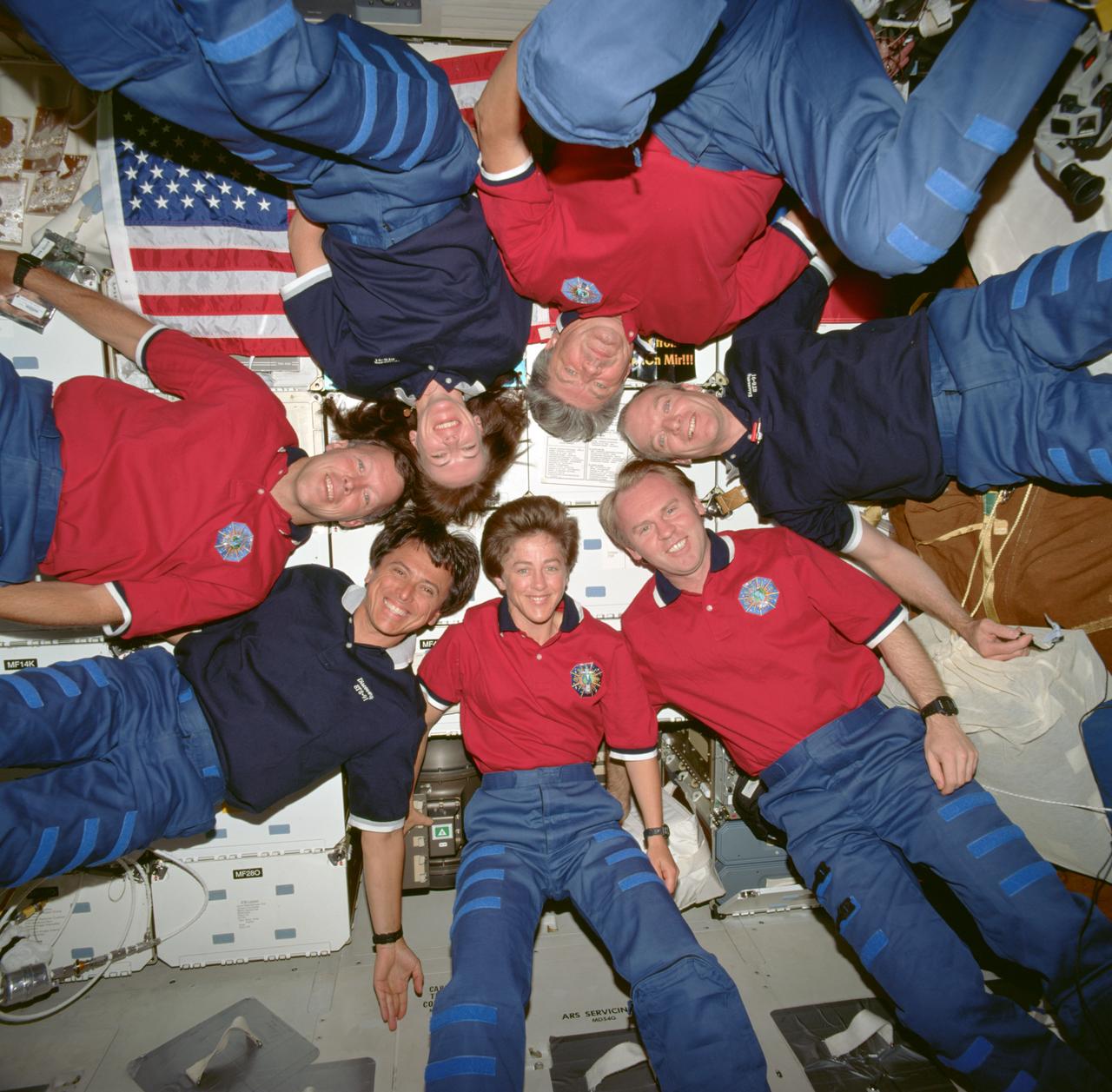 STS091-718-012 (2-12 June 1998) --- The seven crew members of STS-91 assume a &quot;star burst&quot; pose for their traditional in-flight crew portrait aboard the Space Shuttle Discovery.  (For orientation, picture should be held with U.S. flag in upper left corner)  Astronaut Wendy B. Lawrence, mission specialist, is at bottom center.  Others are (counter-clockwise from Lawrence) Andrew S.W. Thomas, mission specialist; Charles J. Precourt, mission commander; Valery V. Ryumin, mission specialist representing the Russian Aviation and Space Agency; Janet L. Kavandi, mission specialist; Dominic C. Gorie, pilot; and Franklin R. Chang-Diaz, payload commander.  A pre-set 70mm camera recorded the portrait.
