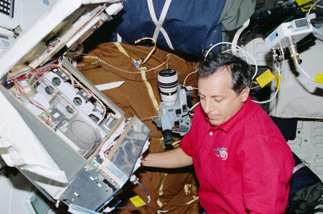 NASA image: STS-93 MS Tognini works with the CGBA experiment on the middeck of Columbia
