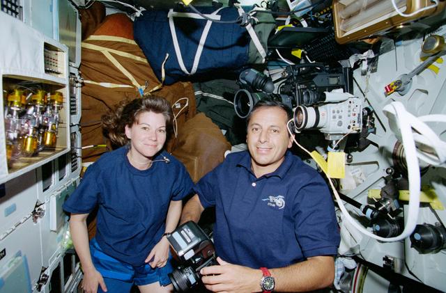 NASA image: STS-93 Tognini and Coleman take photographs on the middeck of Columbia