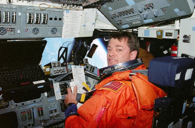 NASA image: STS-93 Pilot Ashby seated at the flight deck pilot's station