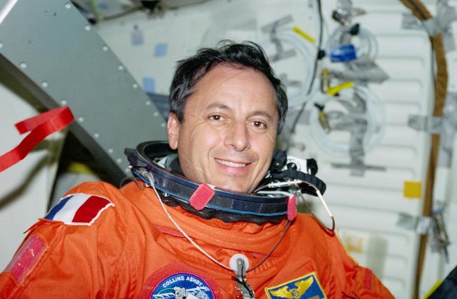 NASA image: STS-93 MS Tognini poses for photos after putting on his LES on the middeck