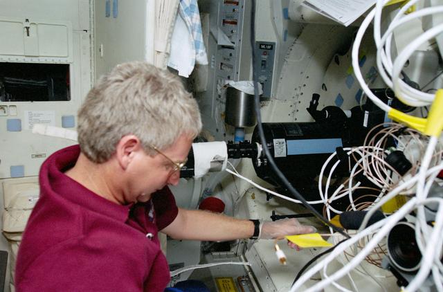 NASA image: Mission Specialist Hawley works with the SWUIS experiment