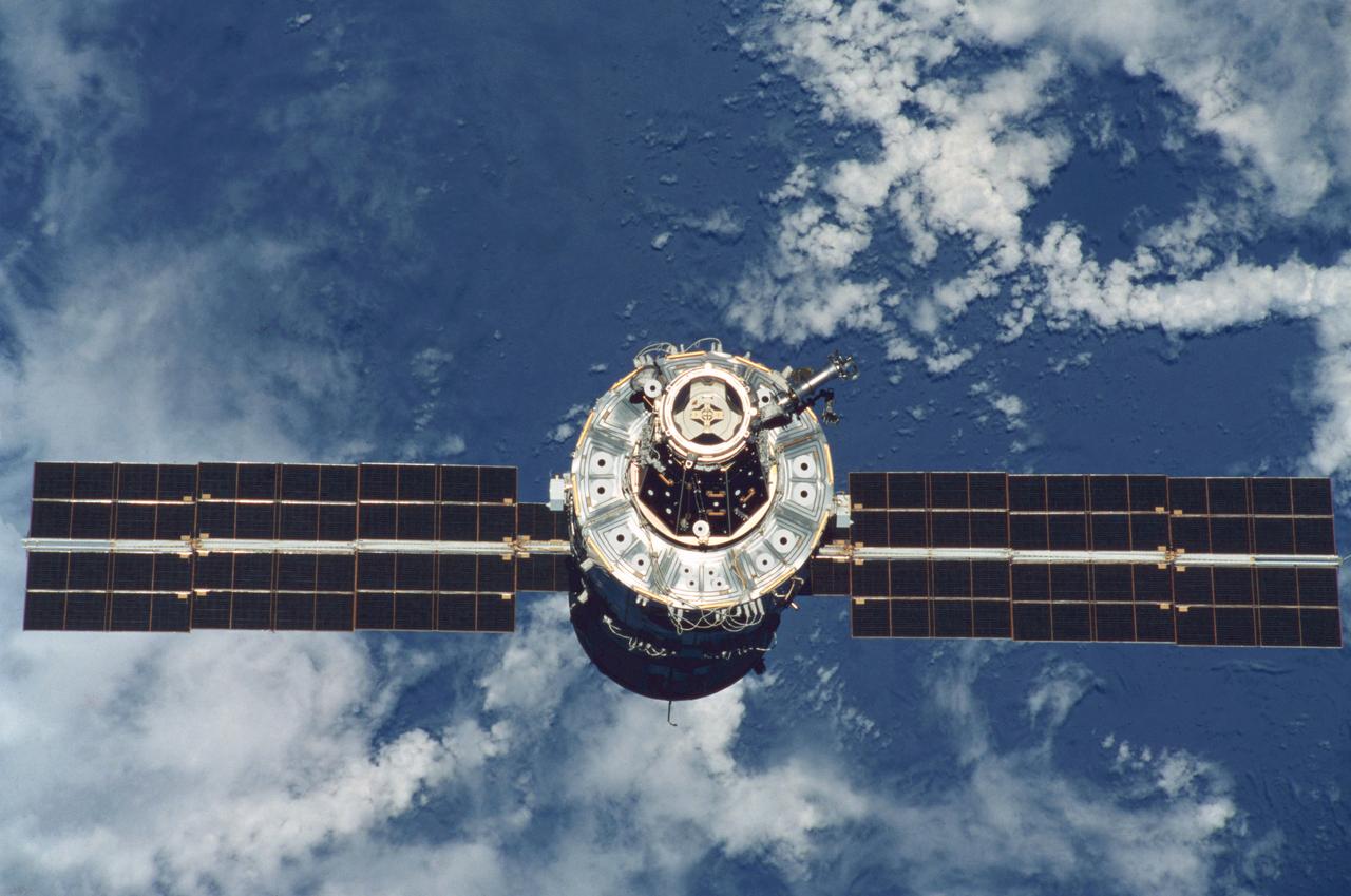 STS096-345-033 (3 June 1999) --- A STS-96 crew member aboard Discovery handling a 35mm camera recorded this image of the International Space Station (ISS) during a fly-around following separation of the two spacecraft.  A portion of the work performed on the May 30 space walk by astronauts Tamara E. Jernigan and Daniel T. Barry is evident in the photo, including the installation of the Russian-built  crane (called Strela).