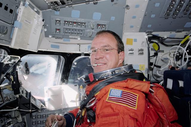 NASA image: Pilot Bloomfield at the pilot's workstation during re-entry preparations