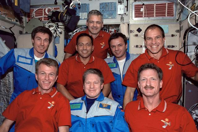 NASA image: STS-97 and Expedition One crewmembers pose for a photo in the Service Module