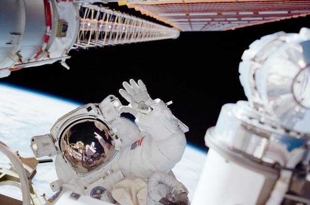 NASA image: MS Noriega waves while working on the P6 during the second EVA of STS-97