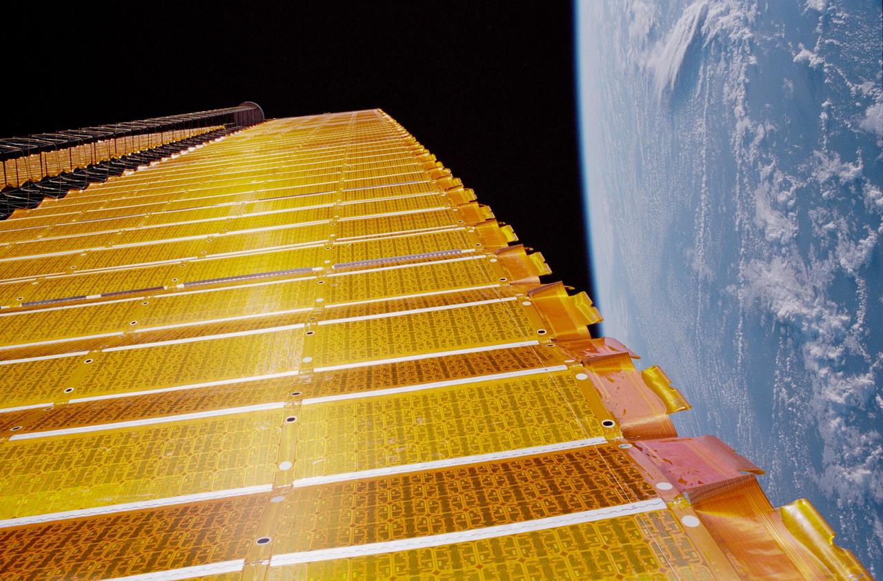 STS097-376-006 (7 Dec 2000) --- A close-up view of the P6 solar array on the International Space Station (ISS), backdropped against the blackness of space and the Earth?s horizon. The P6 solar array is the first of eight sets of solar arrays that at the completion of the space station construction in 2006, will comprise the station?s electrical power system, converting sunlight to electricity.