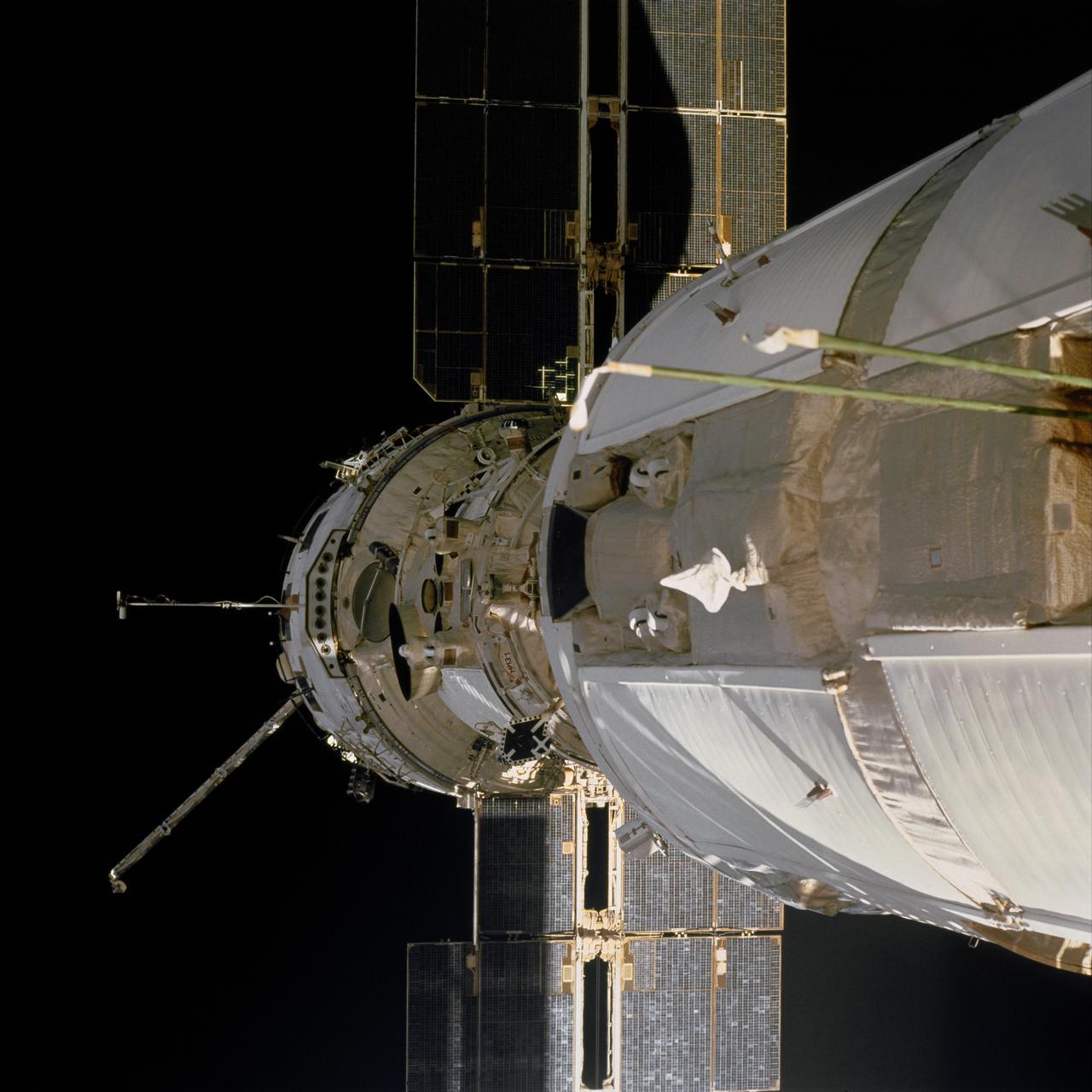 STS097-702-092 (30 Nov.-11 Dec. 2000) --- The Functional Cargo Block (FGB)/Zarya and the Zvezda/Service Module on the International Space Station (ISS) is backdropped against the blackness of space in this close-up 70mm frame, exposed from the aft flight deck of the Space Shuttle Endeavour.