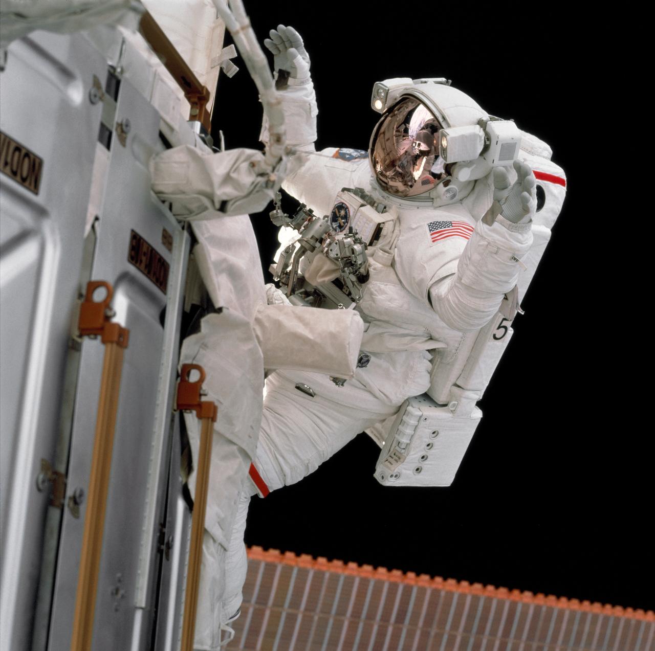 STS097-703-001 (7 December 2000) --- Astronaut Joseph R. Tanner participates in the December 7 extravehicular activity (EVA), one of three space walks involving him and astronaut Carlos I. Noriega. The photograph was taken by one of the non-EVA STS-97 crew members, using a 70mm camera.